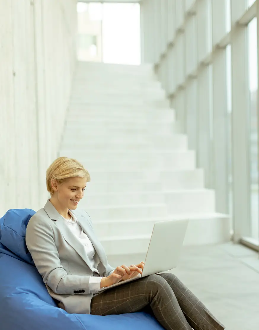 Solopreneur coach working from a laptop at home
